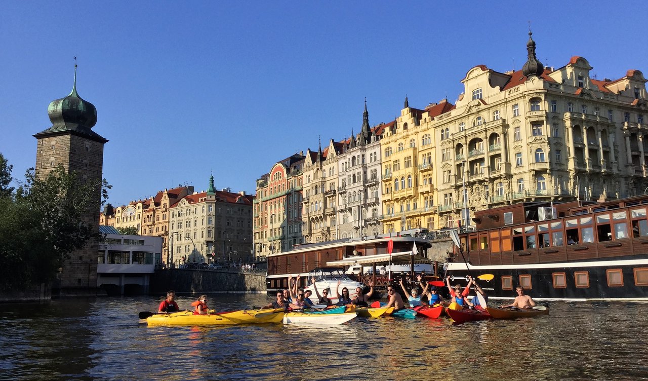 A group of people in kayaks who look happy